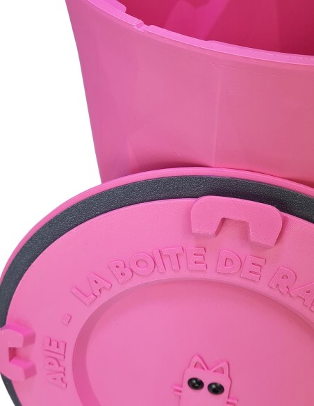 Lifestyle photo of the candy pink Crocketbox APIE on a living room shelf